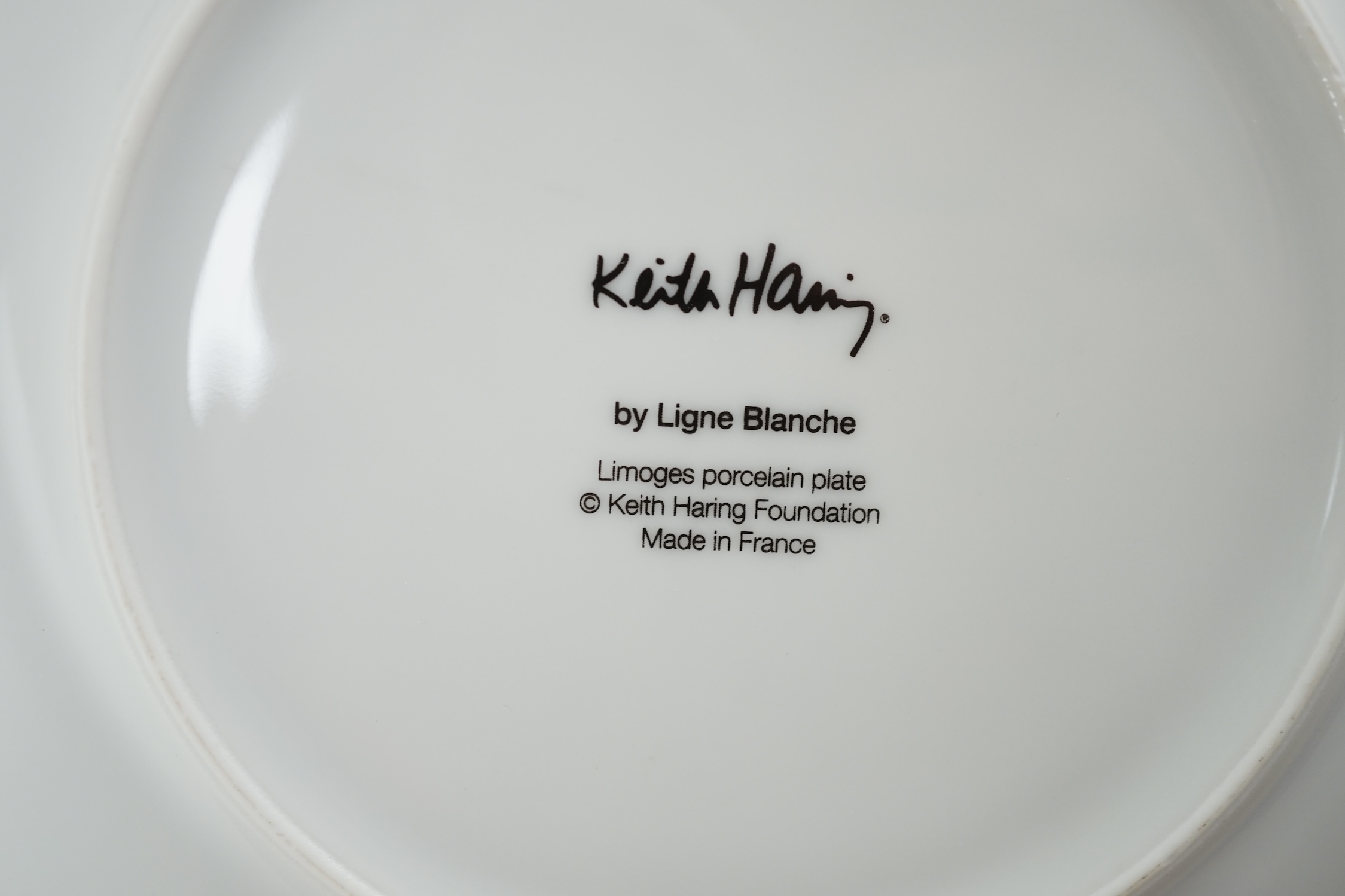 Keith Haring (American, 1958-1990) designs, a set of six Ligne Blanche, Limoges porcelain plates